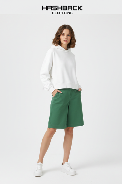 Model wearing green cotton baggy shorts