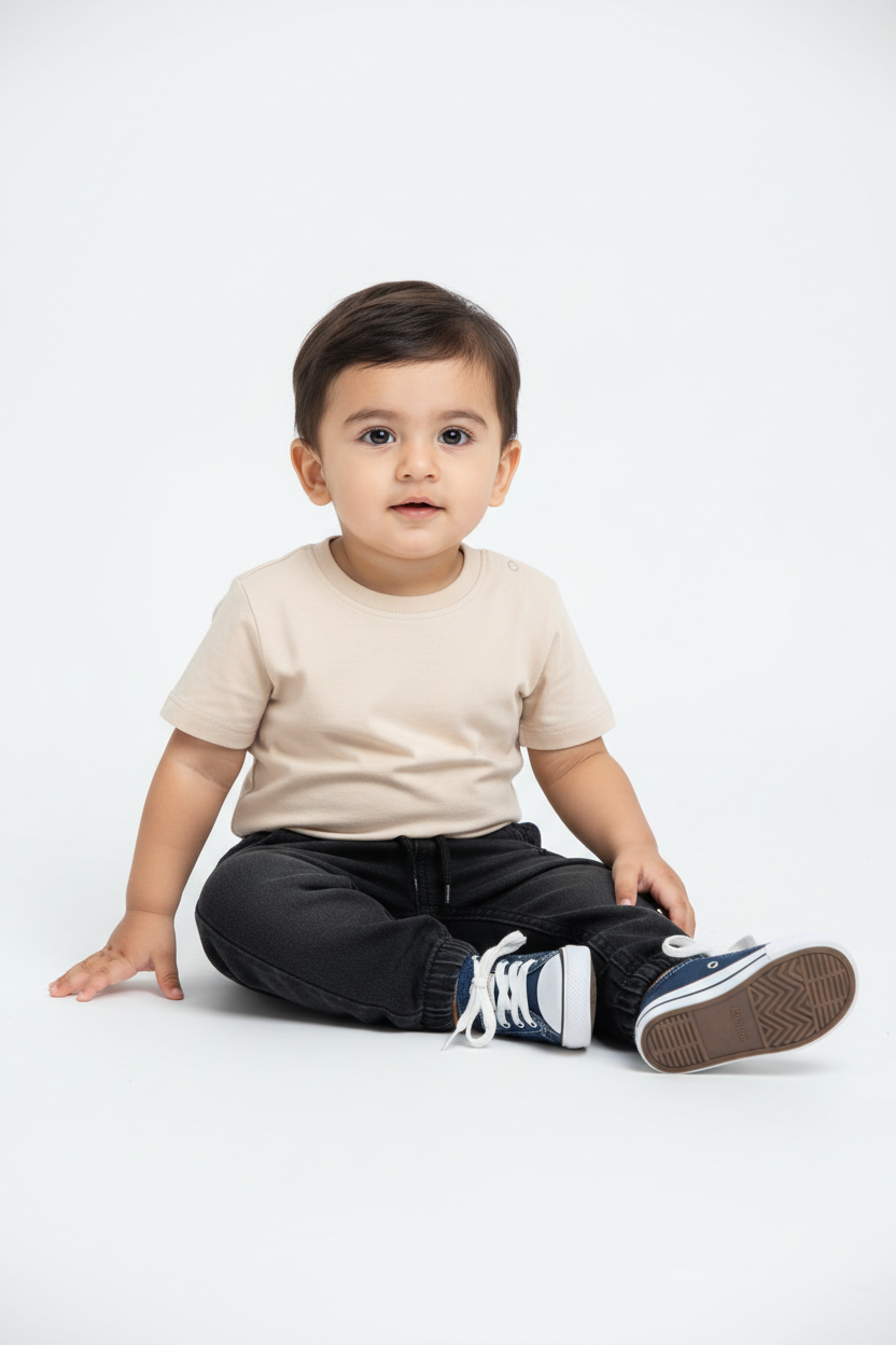 Pakistani baby boy sitting - dark denim joggers